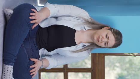 Vertical-video-of-Exhausted-thoughtful-woman-leaning-her-head-against-the-wall.